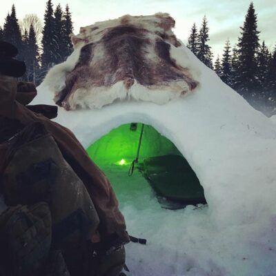 Snow hole/quinzee in Sweden. A dome-like small tent sized house built out of snow and other natural resources.